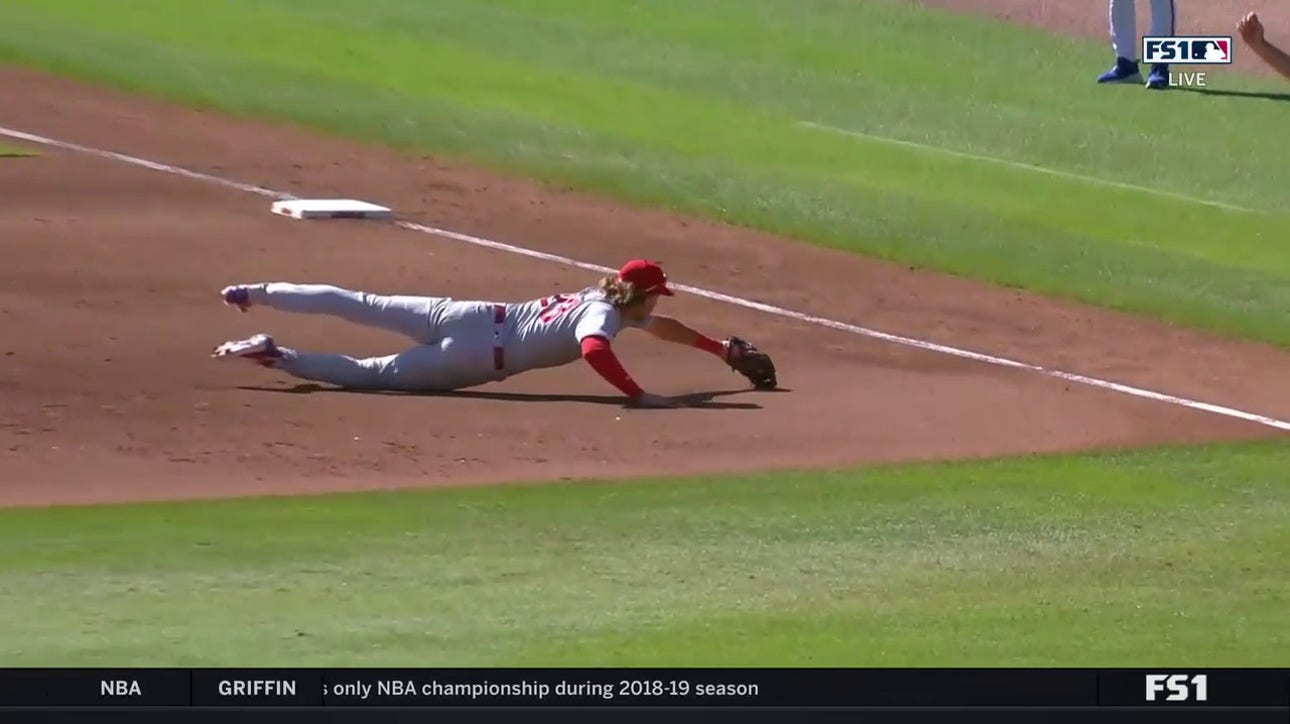 Phillies' Alec Bohm makes a diving stop and throws out the runner at first
