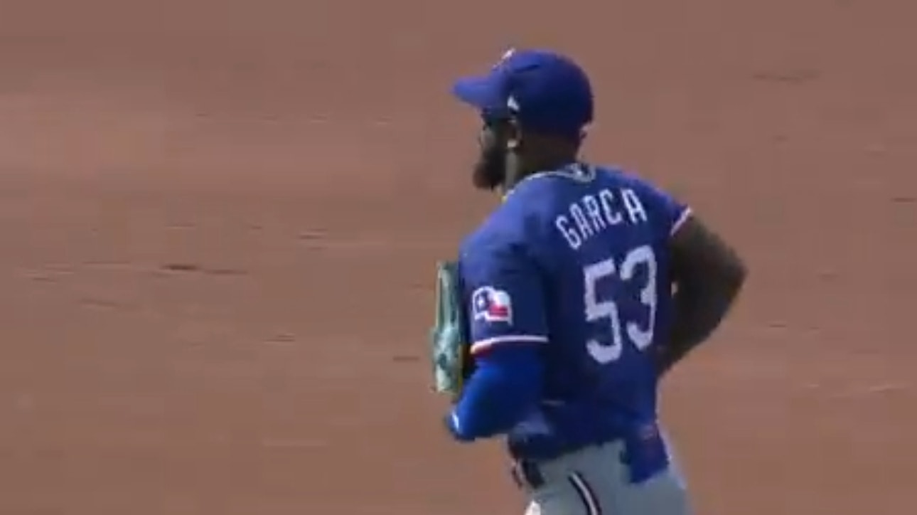 Rangers' Adolis García throws a laser to get Orioles' James McCann out at home