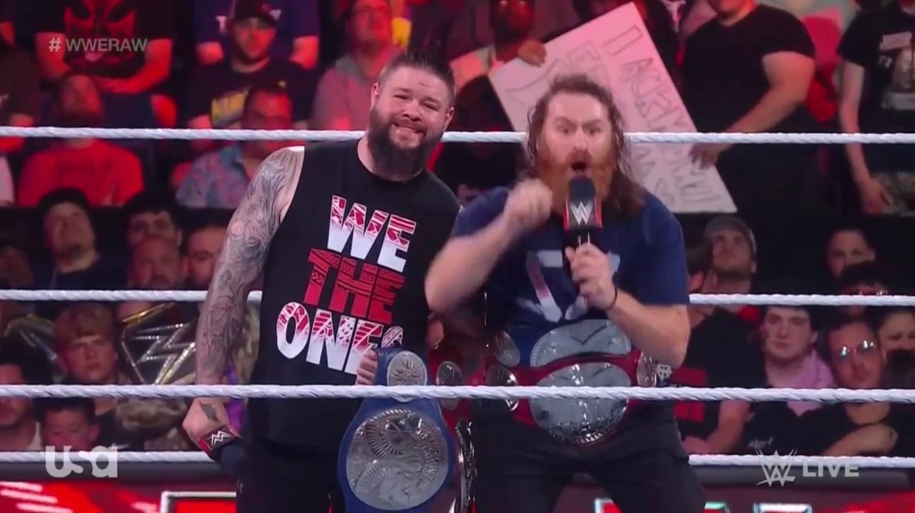 Sami Zayn and KO celebrate after defeating Roman Reigns and Solo Sikoa at Night of Champions