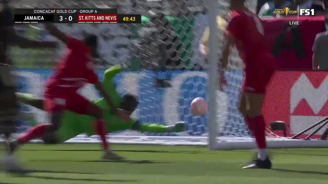 Di'Shon Bernard scores with an impressive goal to extend Jamaica's lead over St. Kitts and Nevis