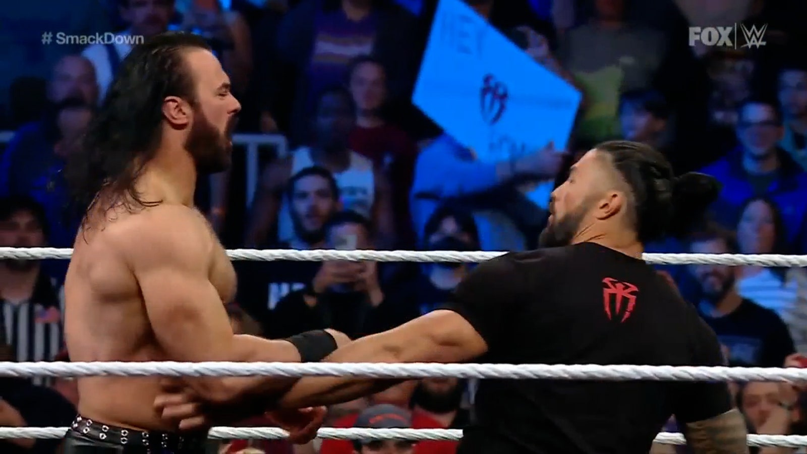 Roman Reigns distracts RK-Bro before clashing with Drew McIntyre during contract signing