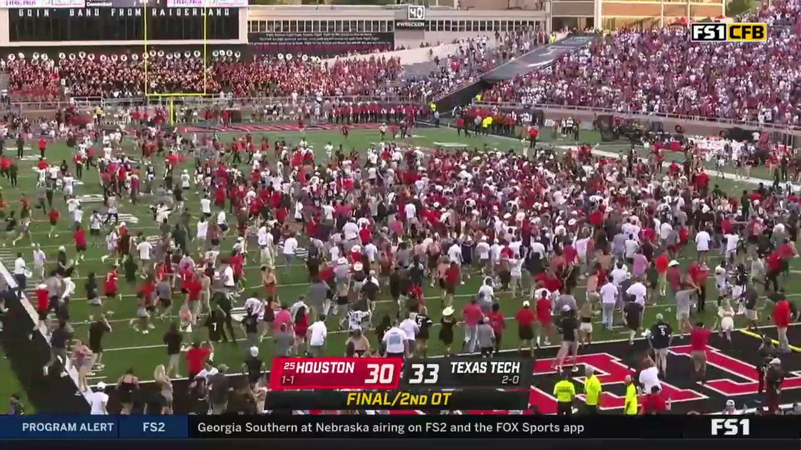 Tech fans rush the field to celebrate upset