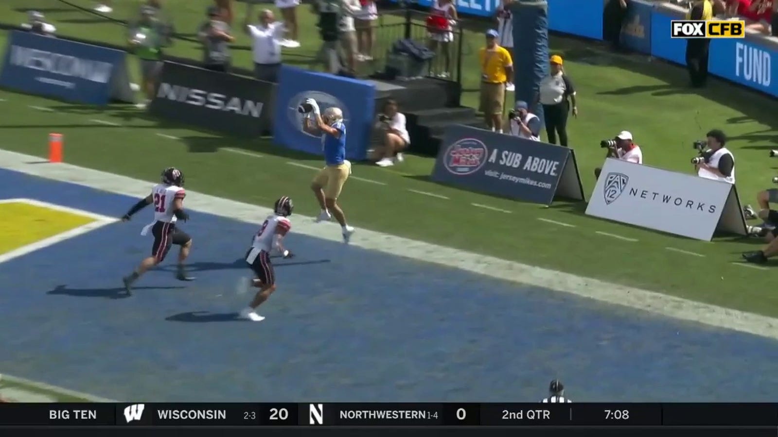 Jake Bobo hauls in the touchdown to push the UCLA lead to 14-3