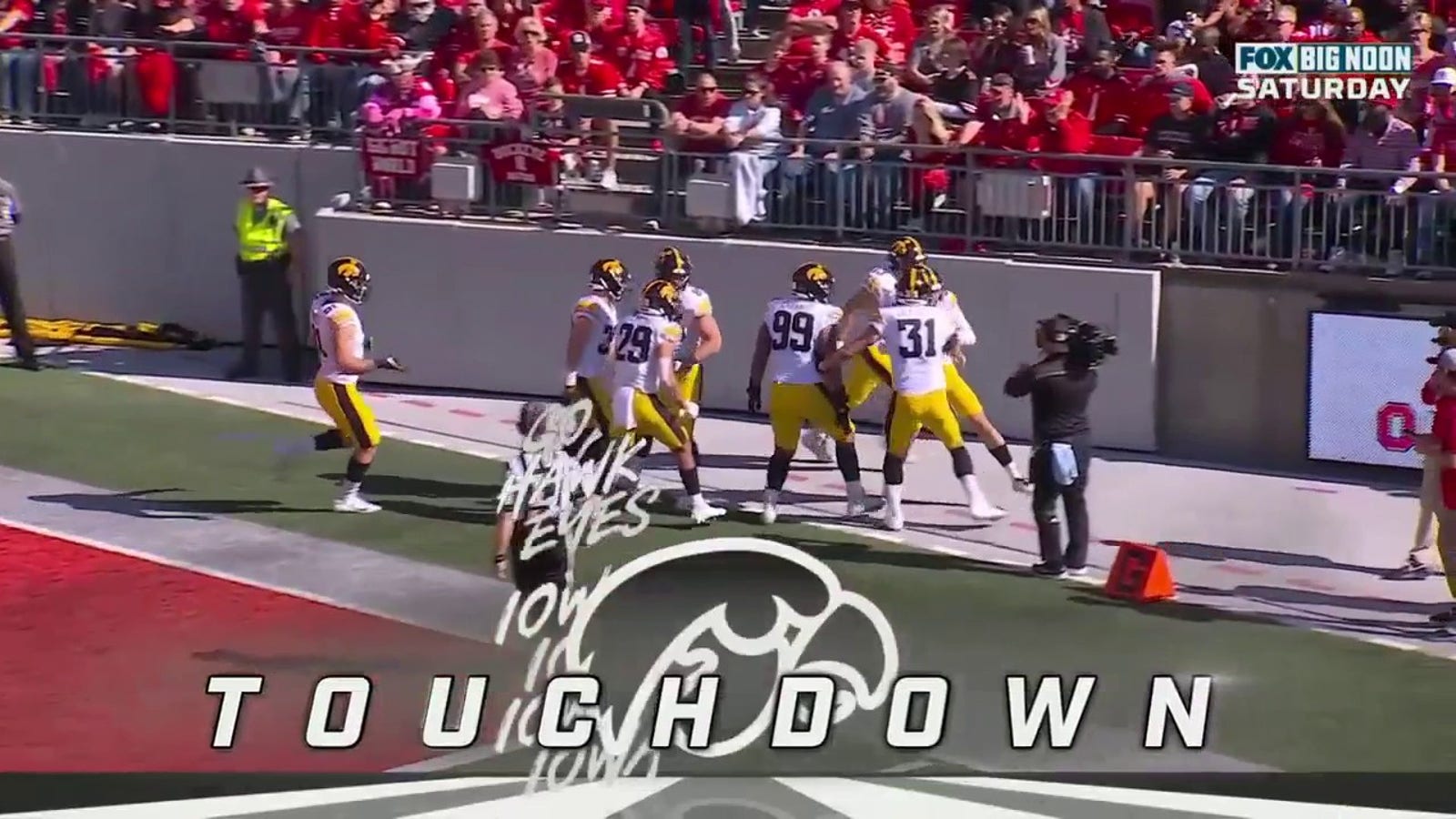 Iowa's Joe Evans recovers a fumble and returns it for an 11-yard touchdown