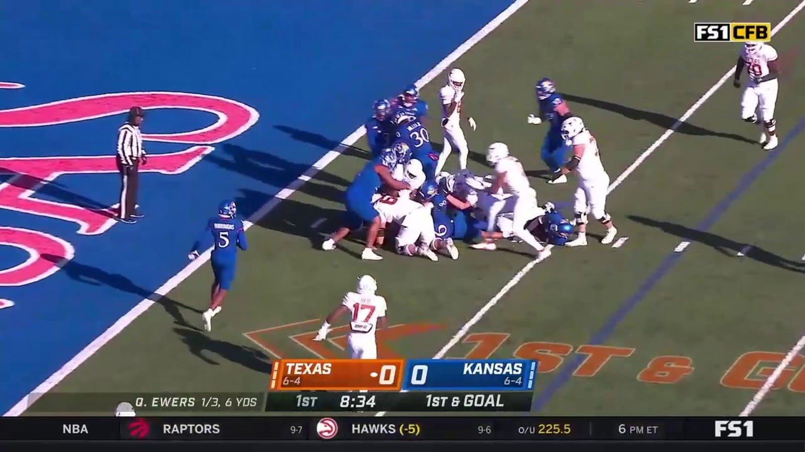 Texas' Bijan Robinson scores on a 2-yard rushing touchdown against Kansas