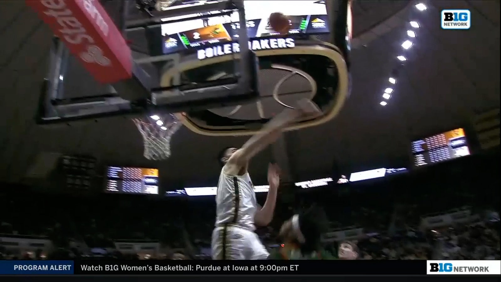 Purdue's Zach Edey slams home an alley-oop dunk and blocks a shot into the stands on the other end
