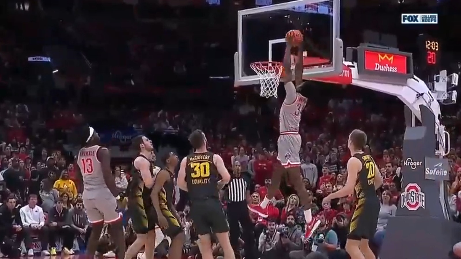 Ohio State's Felix Okpara throws down an alley-oop dunk off a pass from Isaac Likekele