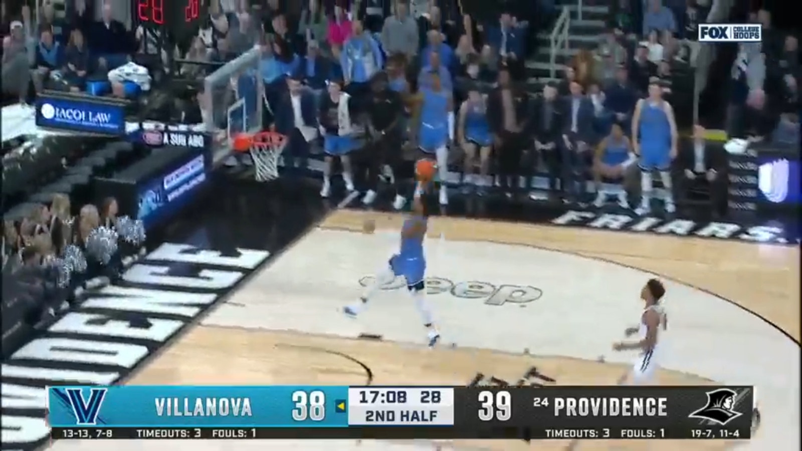 Villanova's Cam Whitmore breaks free for a slam dunk after a Providence turnover