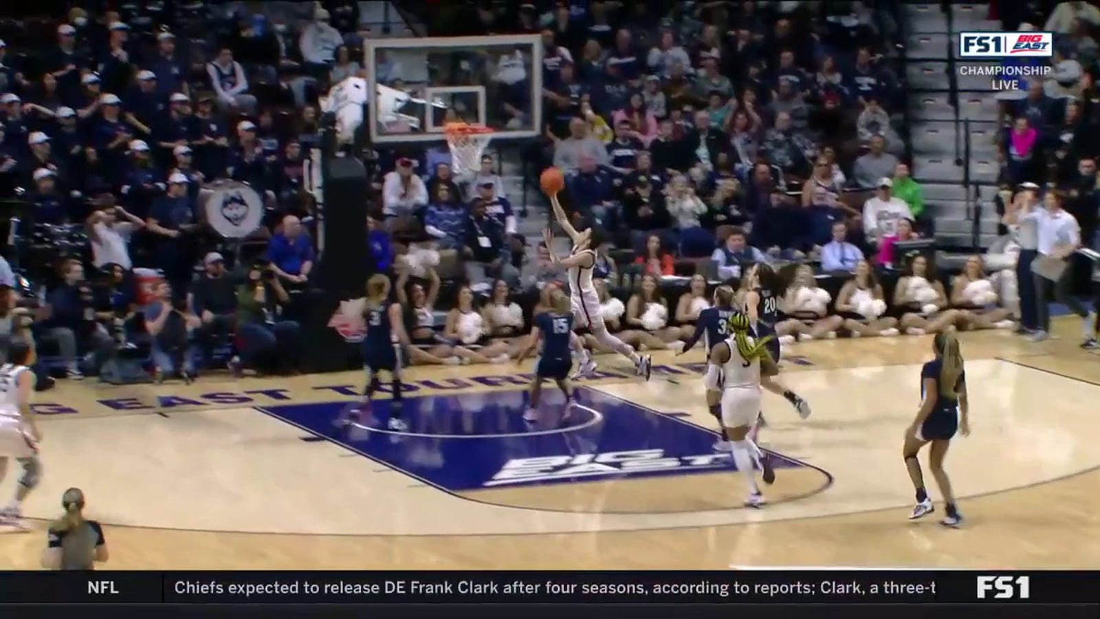UConn's Lou Lopez Senechal extends the Huskies' lead with the help of teammate Nika Muhl