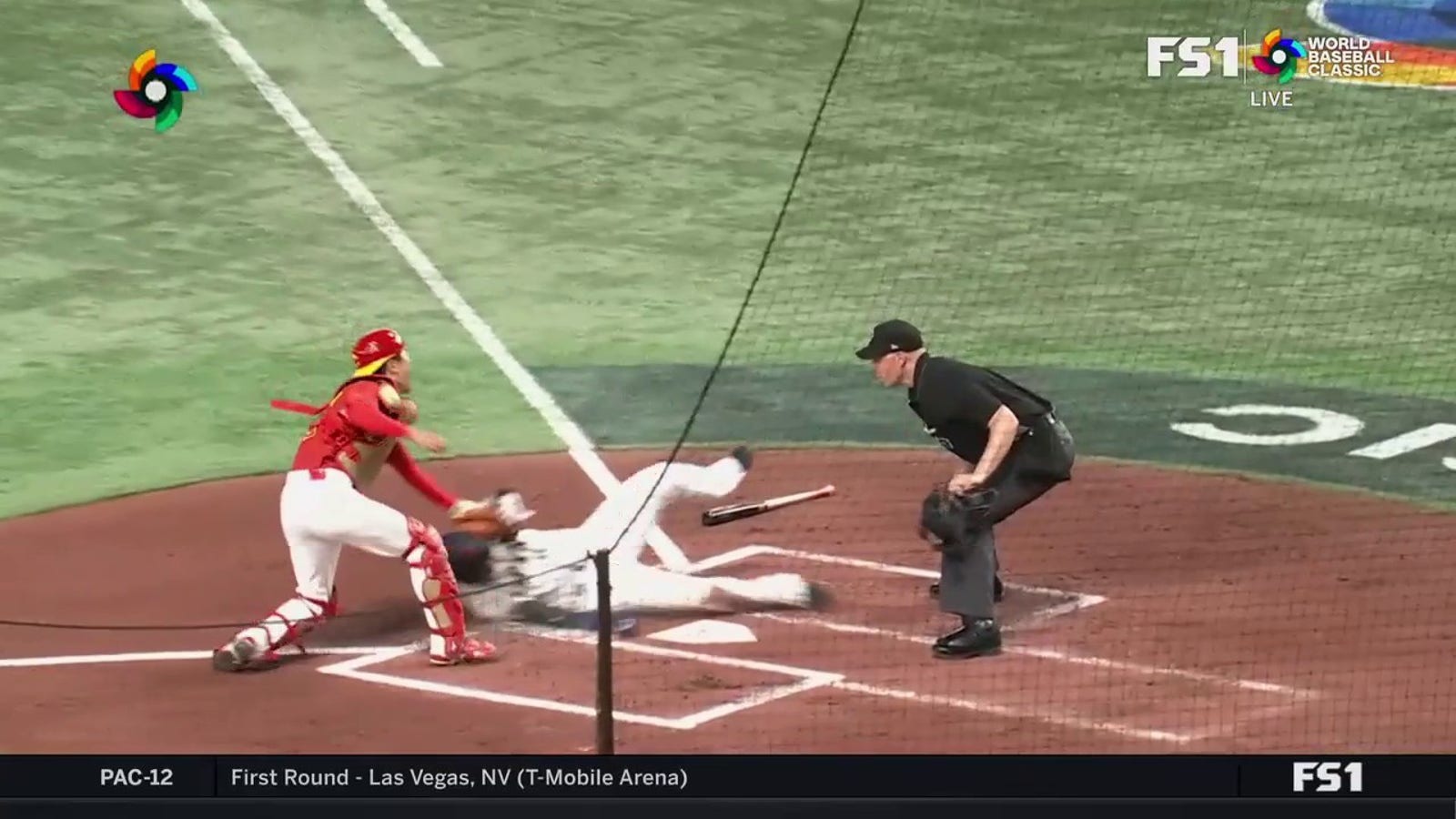 Pei Liang makes a catch and throws the runner home to limit China's damage against Japan