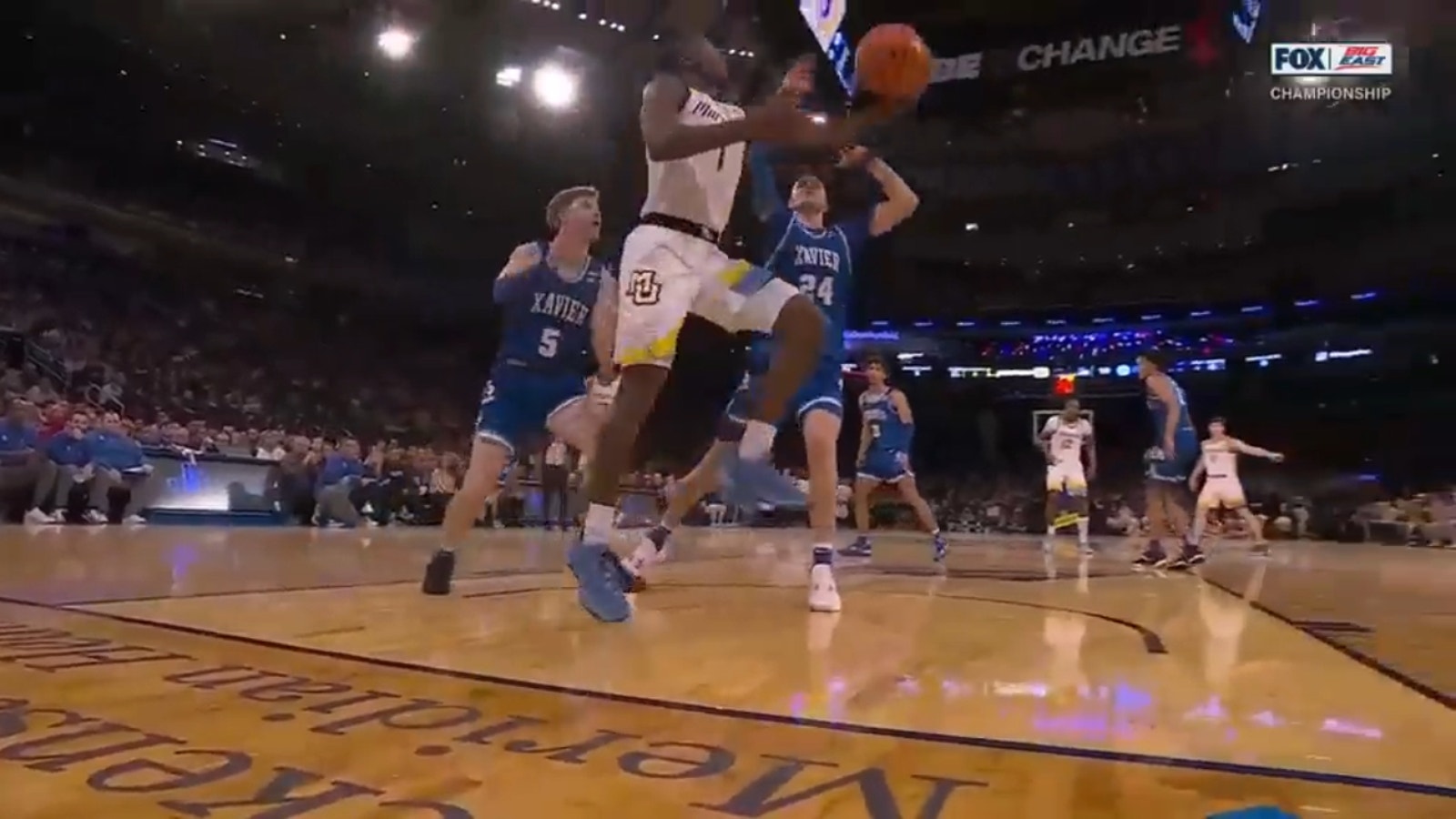 Kam Jones throws down a wicked reverse layup to extend Marquette's lead