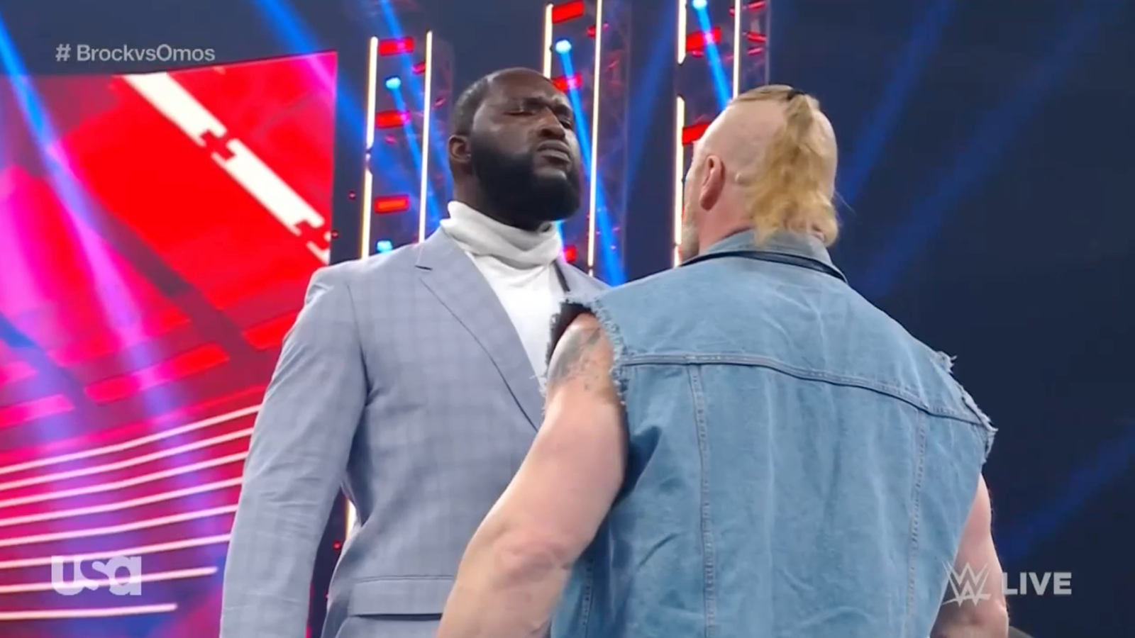 Omos tosses Brock Lesnar over the ropes ahead of the WrestleMania showdown
