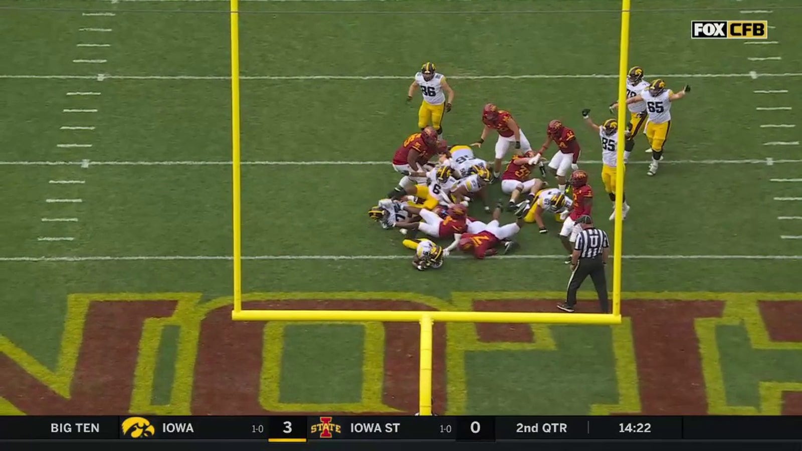 Iowa's Jaziun Patterson rushes up the middle for a four-yard TD