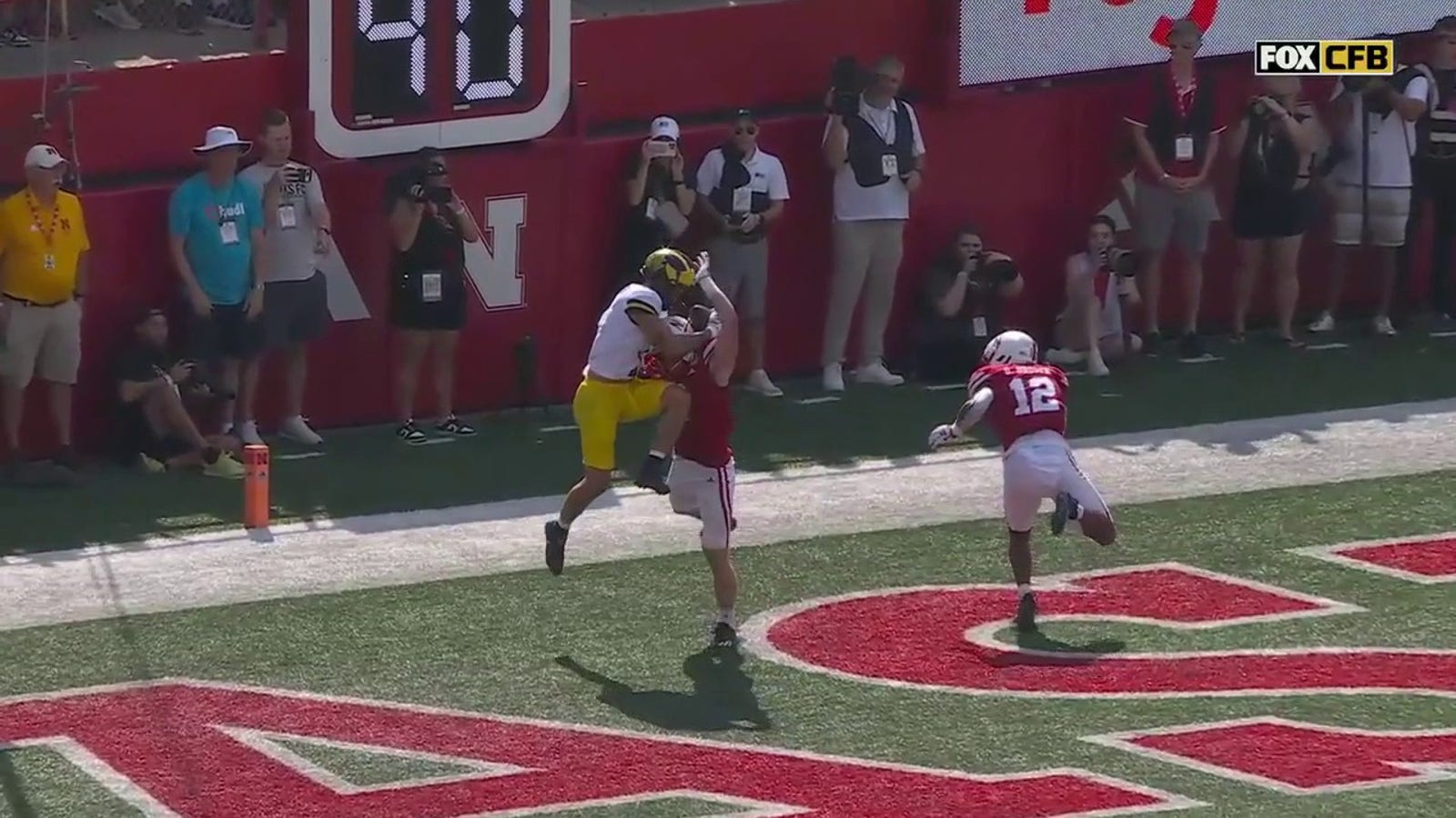 Roman Wilson makes an UNREAL contested TD reception as Michigan strikes first against Nebraska