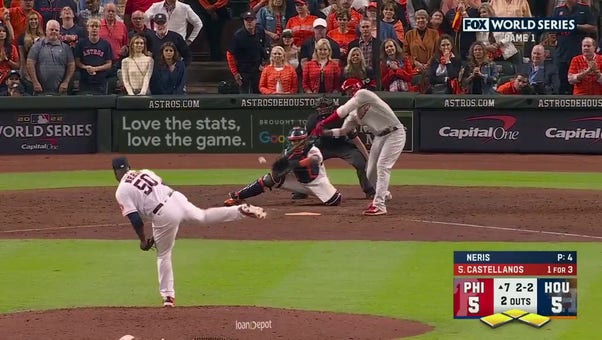 Astros' Hector Neris strikes out Nick Castellanos with the bases loaded to keep the game tied in the seventh inning