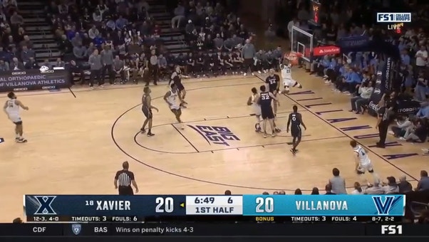 Villanova's Cam Whitmore rips the rim to take the lead