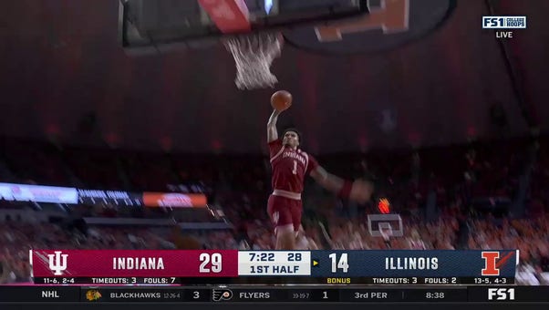 Jalen Hood-Schifino hammers in a one-handed slam to extend Indiana's lead against Illinois