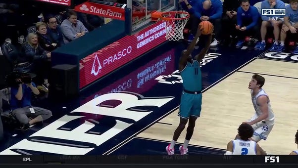 Georgetown's Akok Akok throws down a reverse dunk against Xavier 
