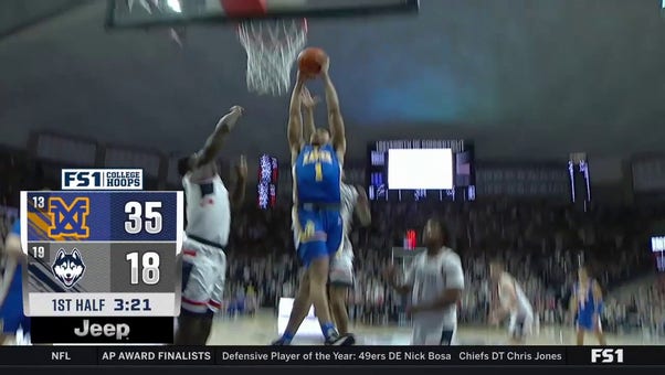 Desmond Claude hammers in an EXPLOSIVE jam, extending Xaviers' lead against UConn