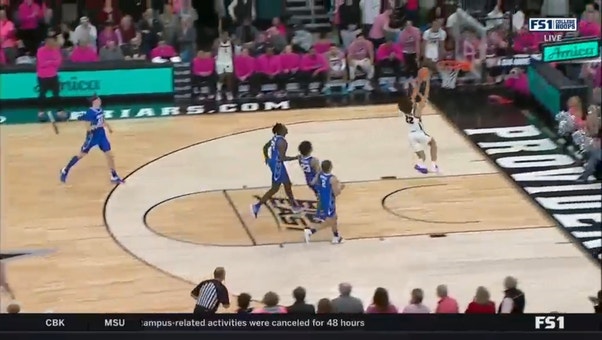 Providence's Devin Carter wins the jump ball for a wicked dunk in OT
