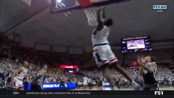 UConn's Adama Sanogo slams home the alley-oop jam to extend the Huskies lead over Providence