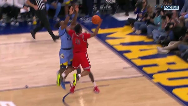 St. John's Posh Alexander makes a tough and-1 finish against Marquette