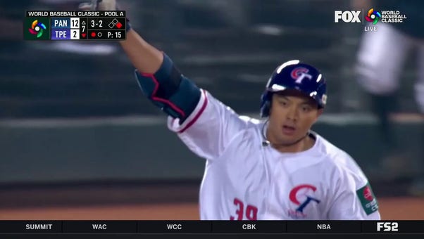 Chinese Taipei's Nien-Ting Wu hits the first home run of the 2023 World Baseball Classic
