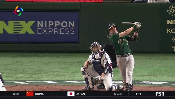 Australia's Robbie Glendinning hits a home run against the Republic of Korea 