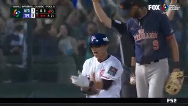 Chieh-Hsien Chen belts a triple to give Chinese Taipei an 8-2 lead over the Netherlands