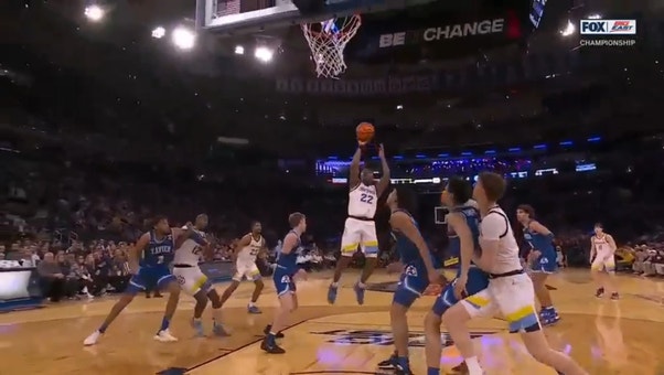 Marquette's Sean Jones hits a spin move and drains the jump shot to extend the lead over Xavier