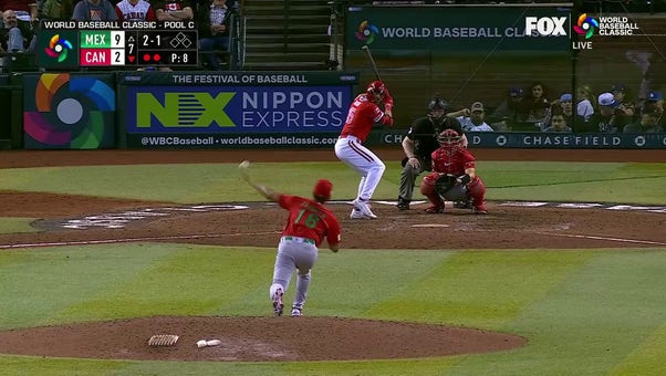 Edouard Julien slams a home run to right center field for Canada against Mexico