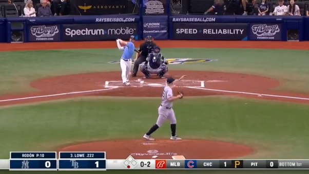 Brandon Lowe SMACKS a solo home run to give the Rays an early lead over the Yankees
