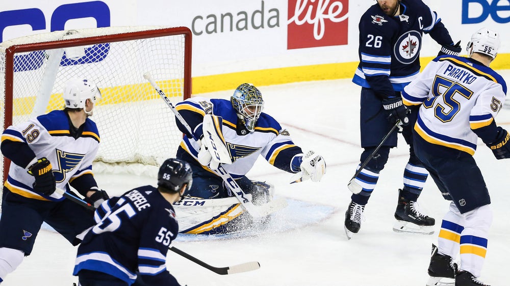 Binnington holds strong as Blues get 2-1 comeback win over Jets to take Game 1