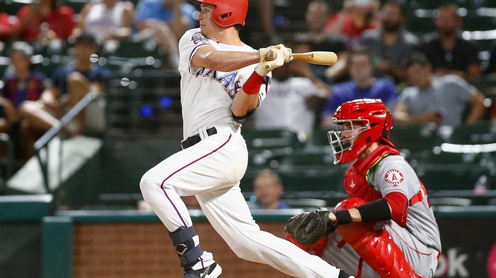 Rookies push Rangers to 3-2 win for split of DH with Angels