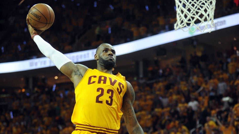 WATCH: LeBron throws down a two-handed reverse fast-break slam