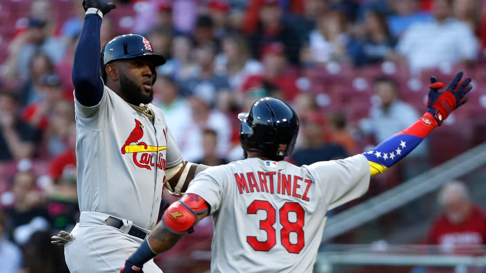 Cardinals run away after seven-run inning to topple Reds 13-4