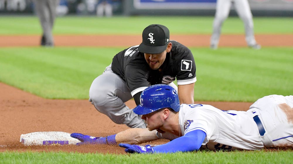 Royals snap their home winning streak in extra inning loss