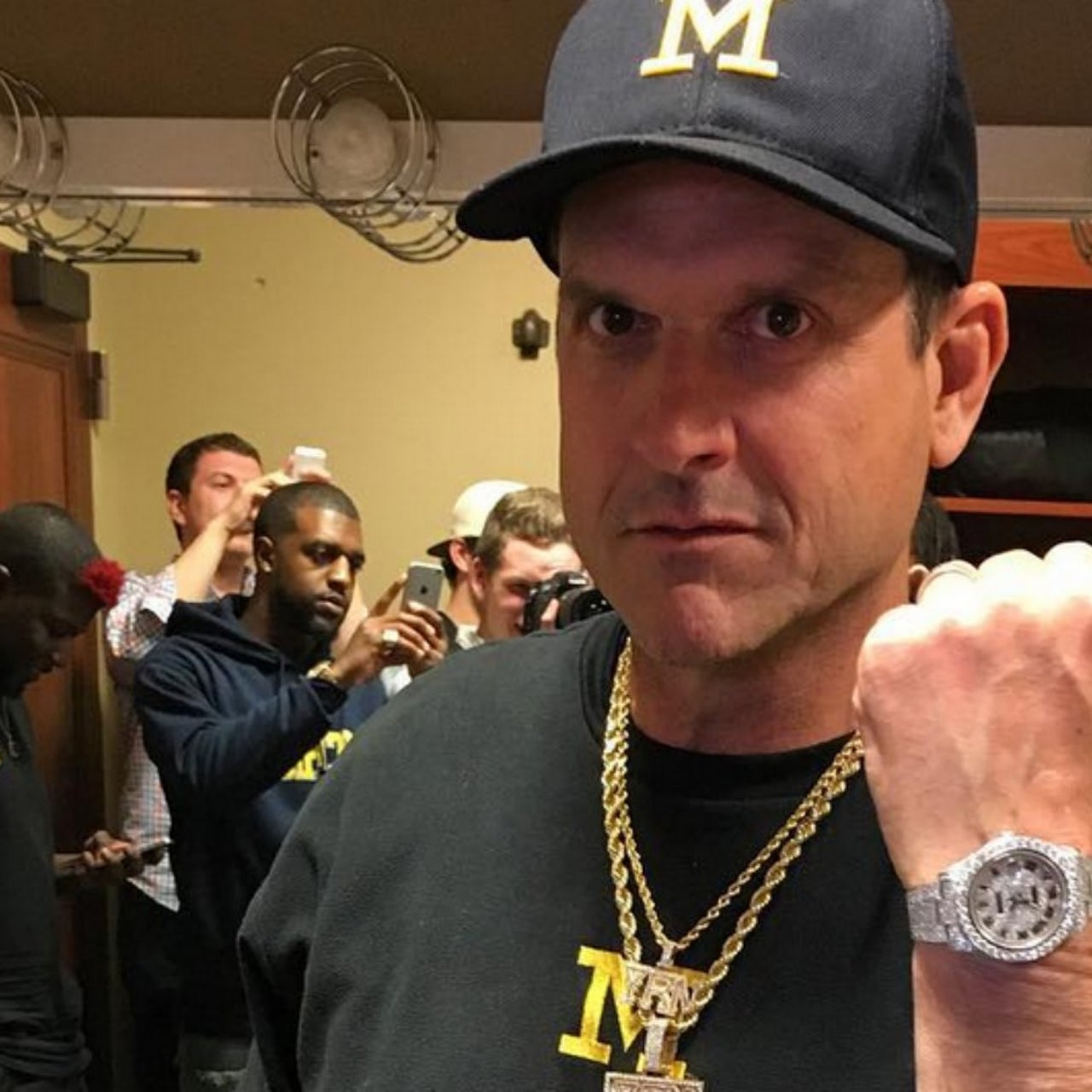 577b5161-041416michgianjimharbaugh.jpg