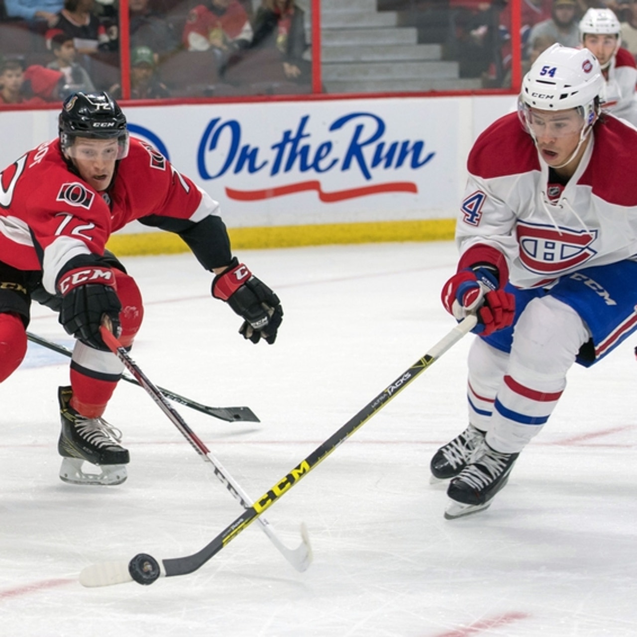 Montreal Canadiens' Mike Johnson (20) is robbed by Ottawa Senators