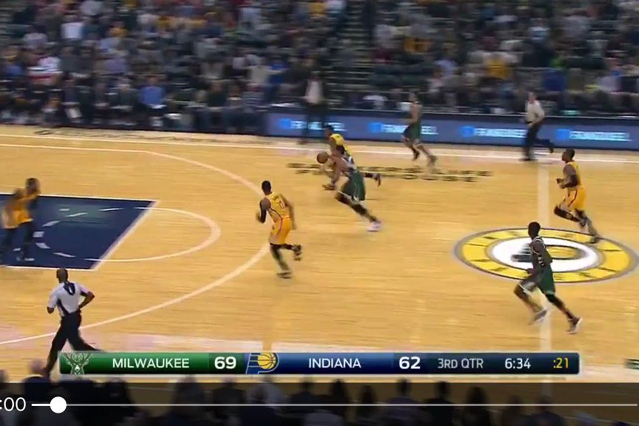 Giannis Antetokounmpo defies gravity while dunking from just inside the