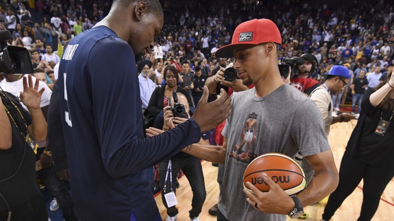 Kevin Durant, Stephen Curry pose for pictures at Warriors media day