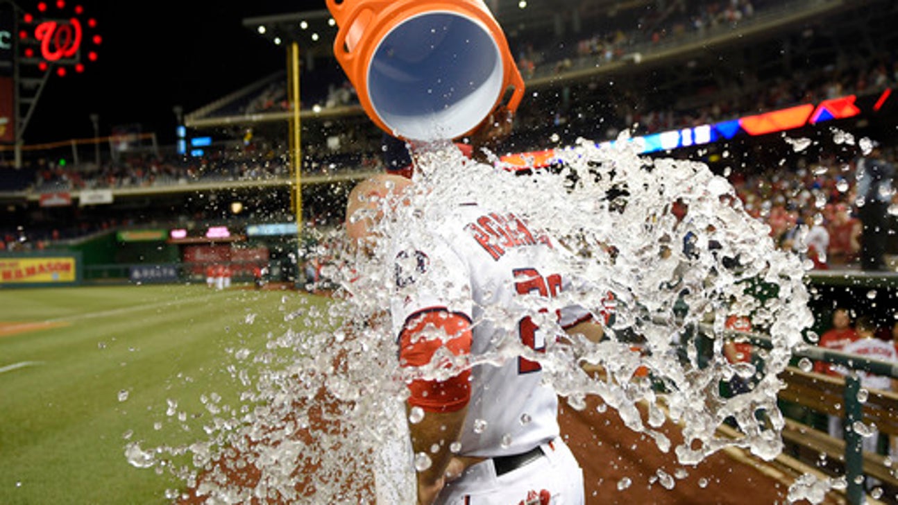 After Harper gets ejected, Robinson lifts Nats past Tigers