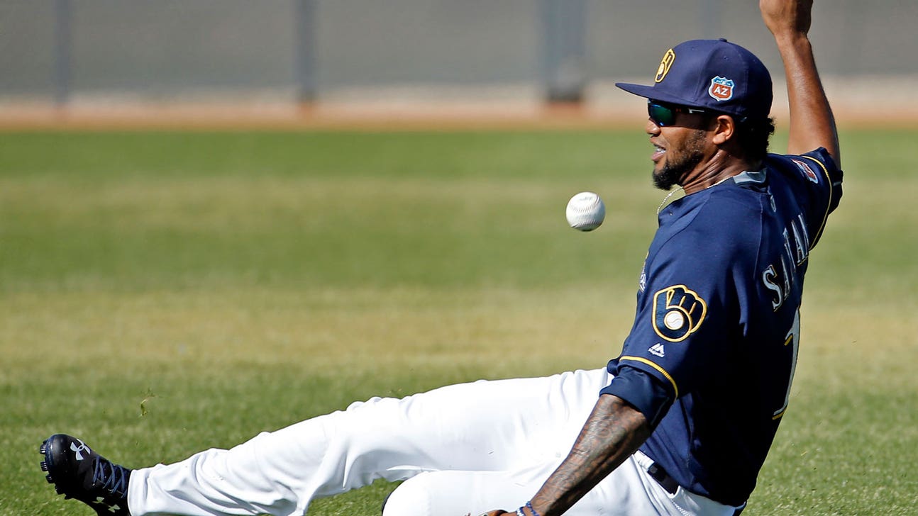 Santana has three hits but Brewers lose 8-5 to Rangers