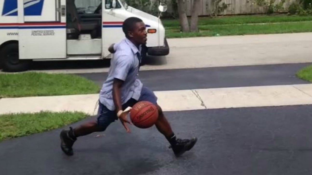 Mailman in full uniform throws down windmill dunk on the job