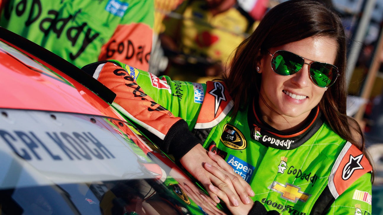 Danica Patrick gets REALLY limber before going for swim