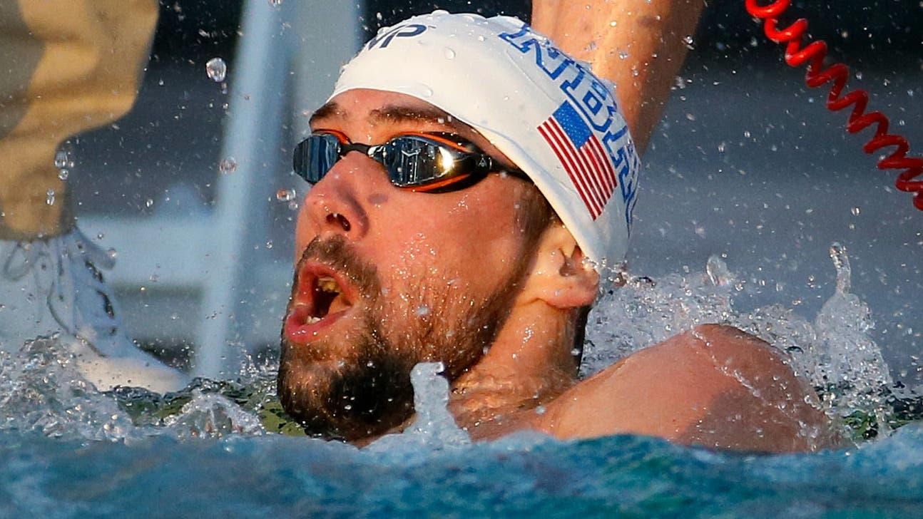 Phelps surges to beat Lochte, wins 100 free in Mesa