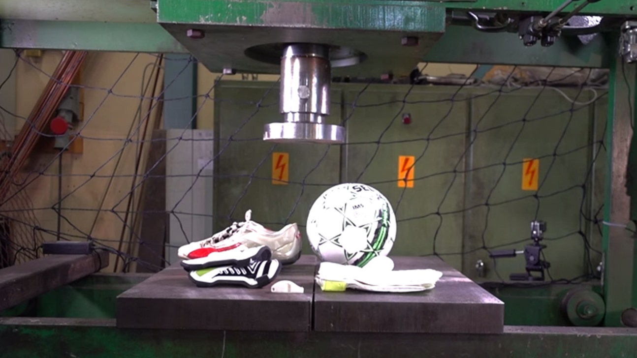 Watch a bunch of soccer gear get destroyed by a hydraulic press