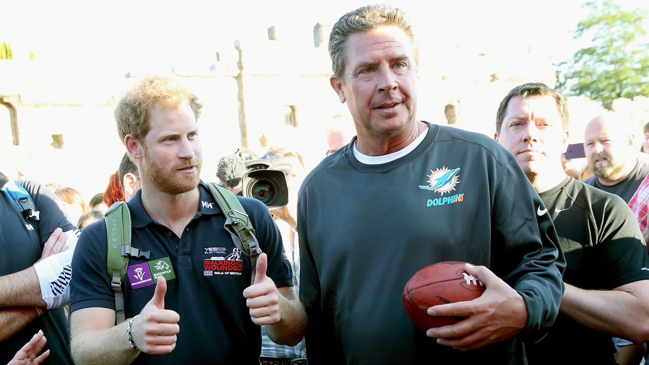 Prince Harry shouts 'Laces out, Dan!' at Dan Marino while playing catch in London