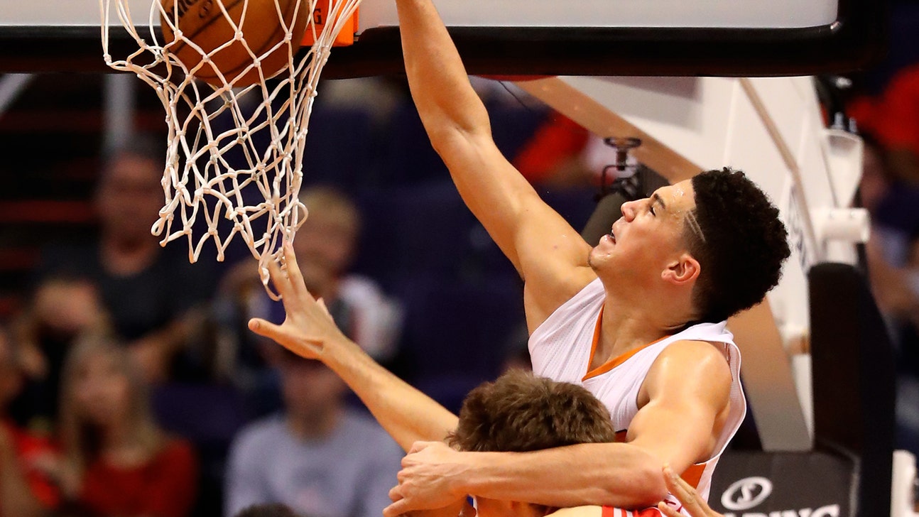 Booker's slams drowned out by Rockets' 3-point barrage