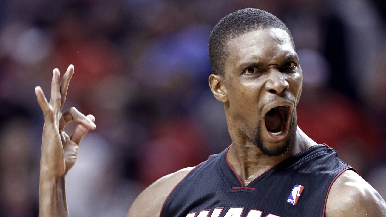 Watch Chris Bosh use both hands to dunk on Andre Drummond
